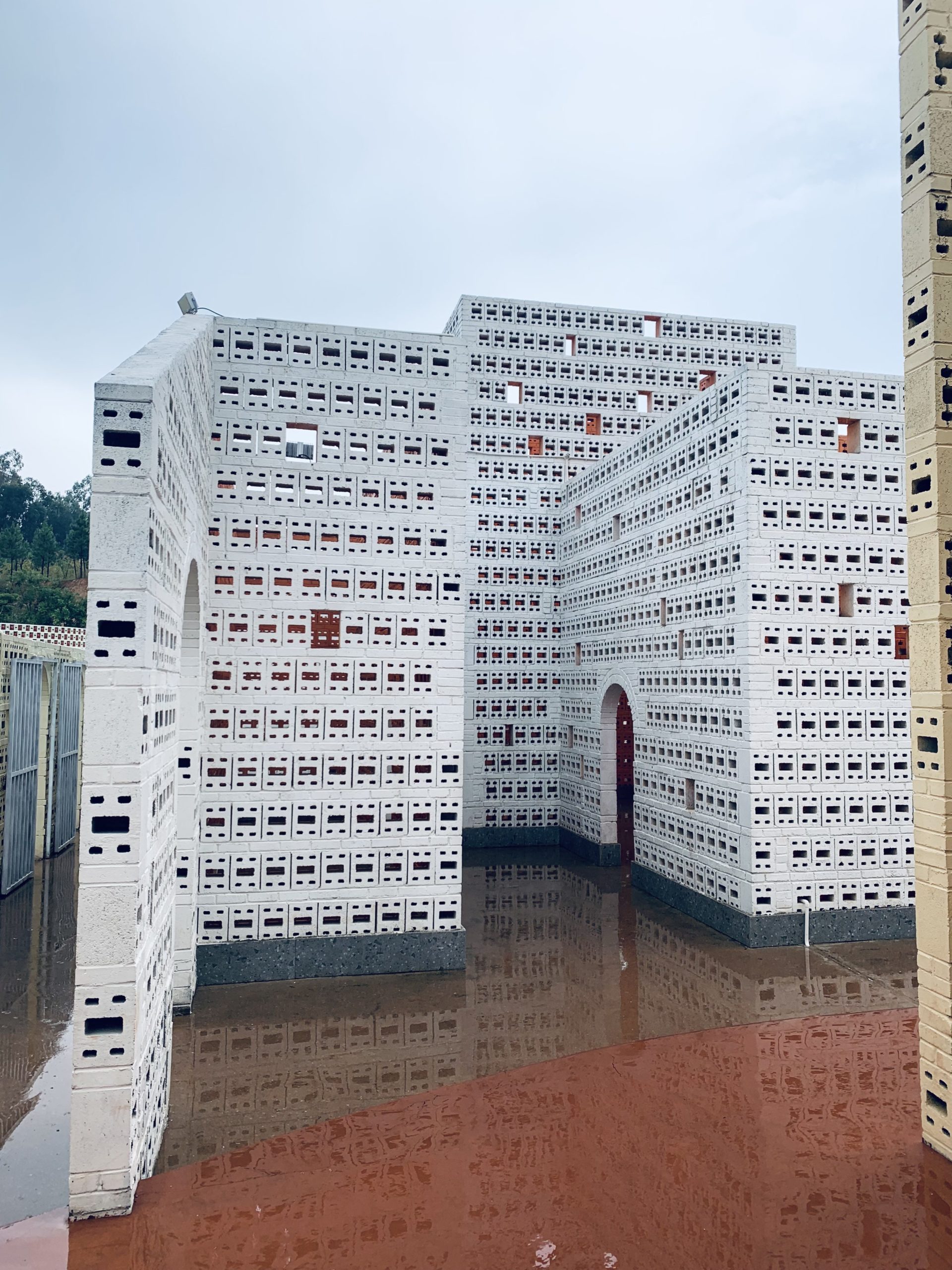 A white brick building at The Ant Workshop in Jianshui