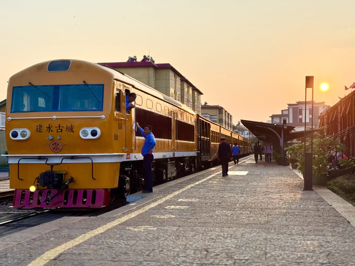 Train officials closing down Jianshui train station at sunset