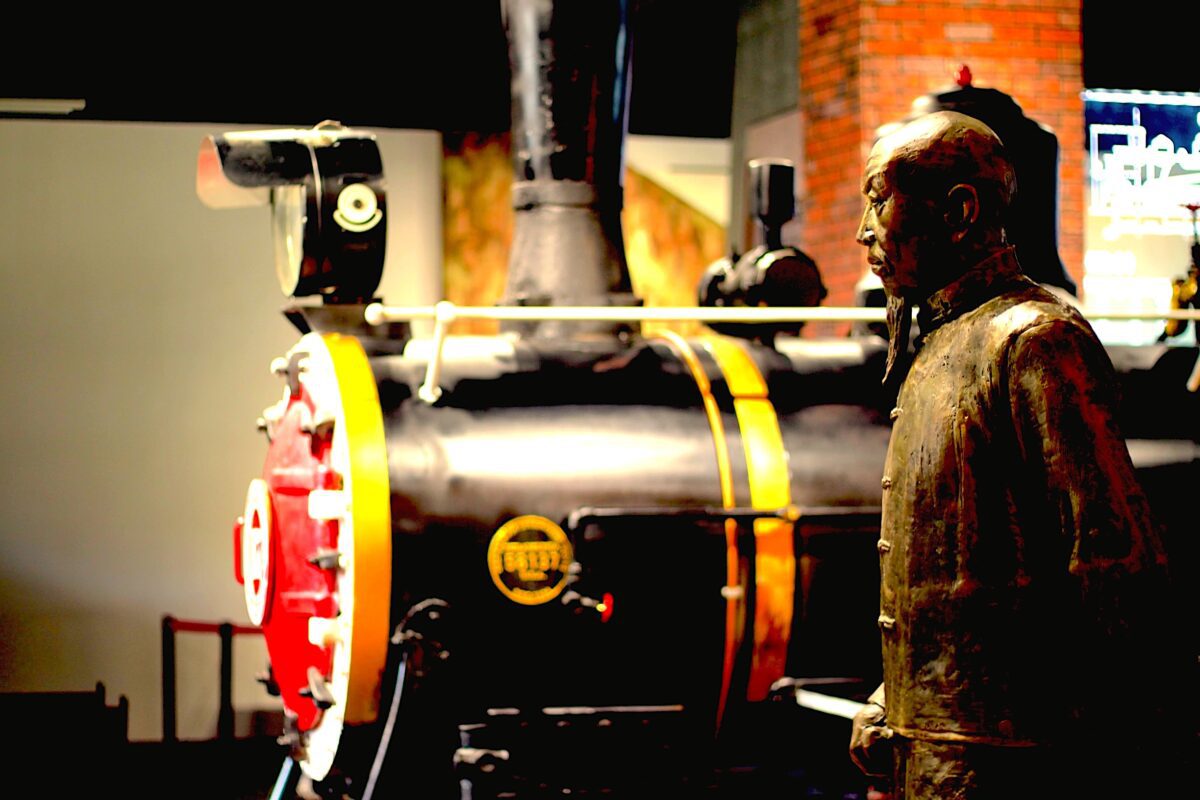 Old locomotive and statue of Shiping native Chen Heting at Shiping Train Station